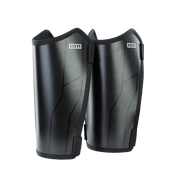 A pair of black shin guards with a subtle textured finish and the brand logo 'ION' printed in white on the upper front, set against a plain white background.