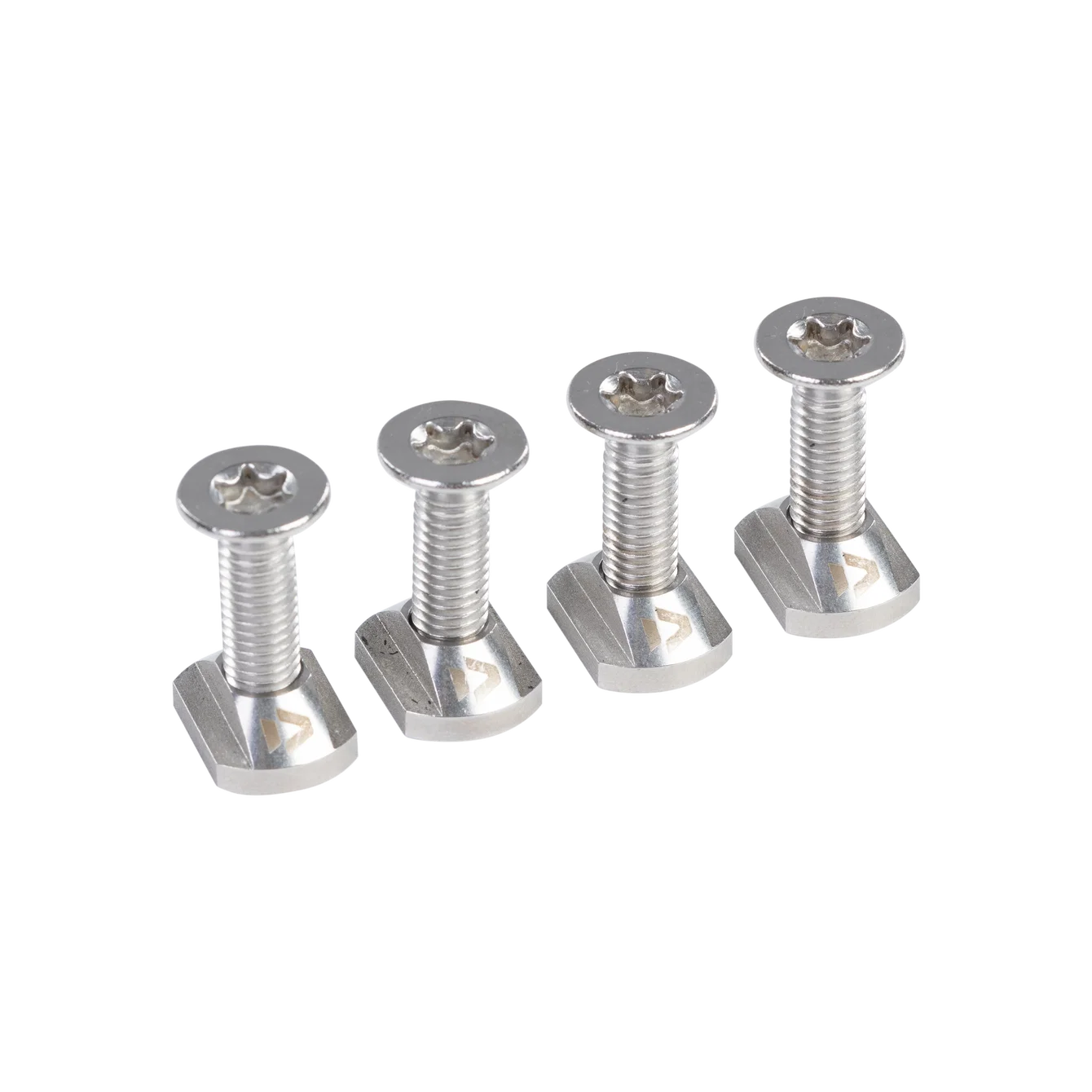 Four silver screws on a white background